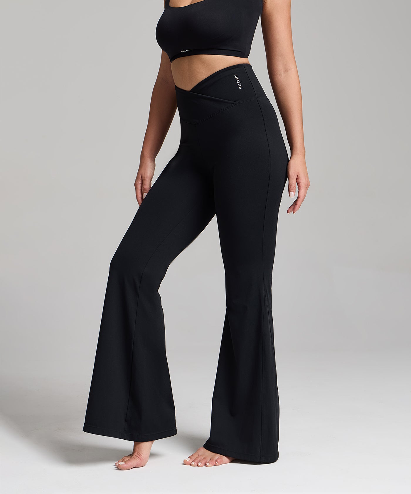 black high-Crossover Flared Leggings